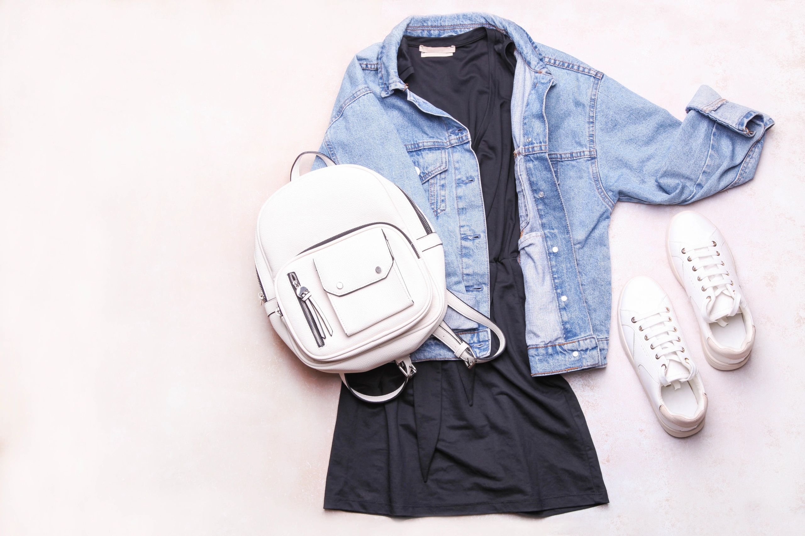 Curated women's fashion items arranged as a boutique-style collage