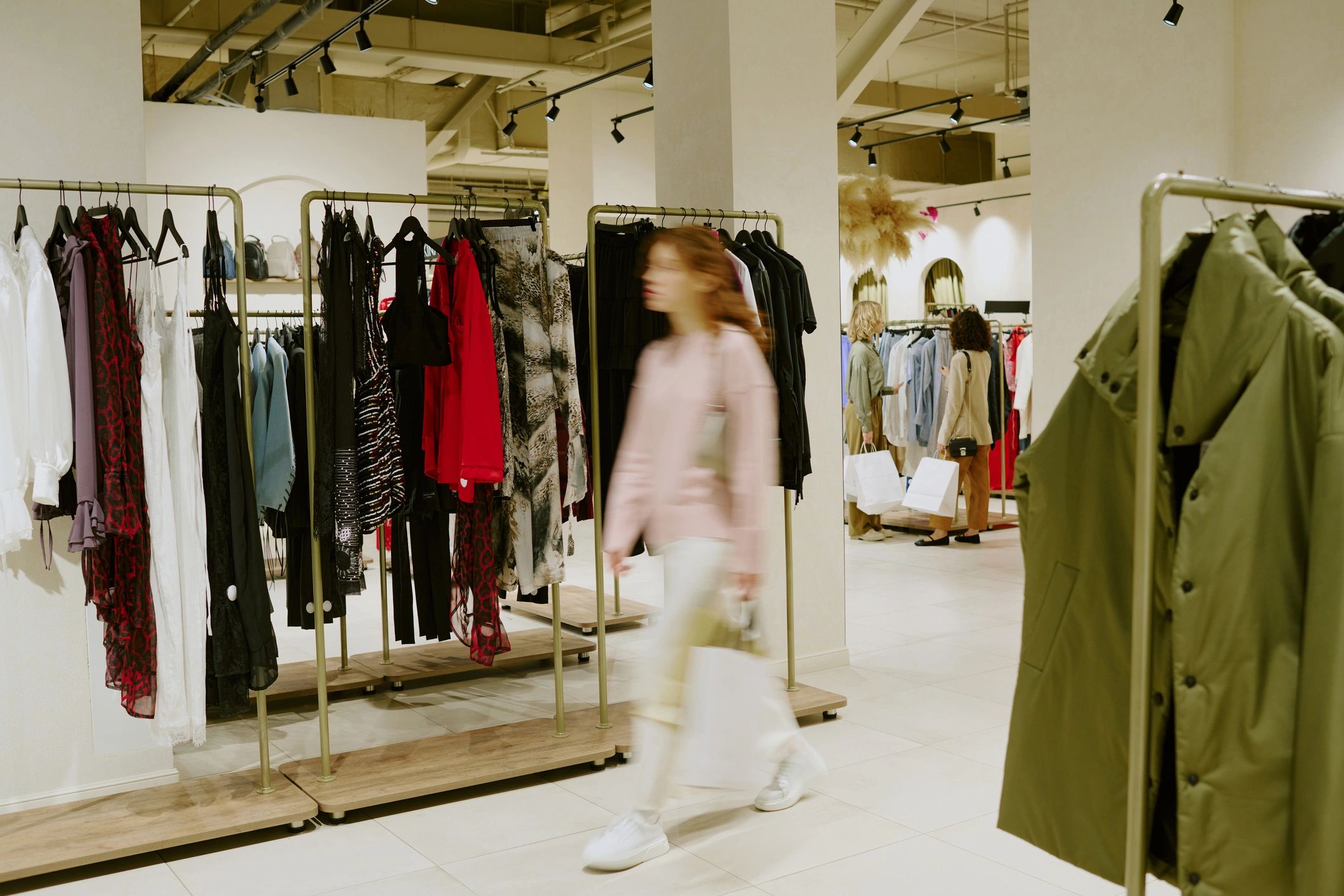 Customer walking through a women's clothing boutique